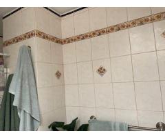 re-grout tile in bathroom